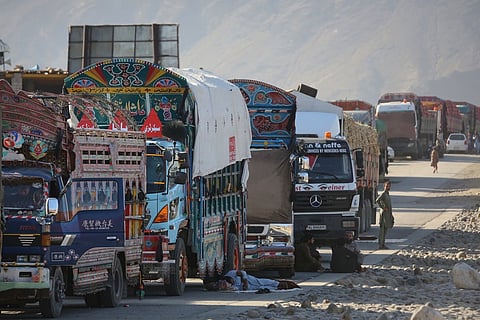 A line of cargo trucks bound for Pakistan is stranded on the Afghan side of the Torkham border crossing, which remained closed after clashes in Nangarhar province, Afghanistan, Tuesday, Oct. 14, 2025.
