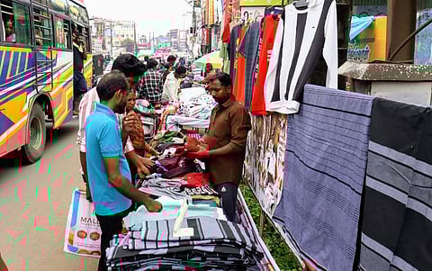 Traders selling their ware at Gandhi road on Wednesday