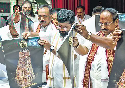Durga temple EO Seena Naik and Trust Board Chairman Borra Radhakrishna release 2026 calendar at a press conference in Vijayawada on Thursday
