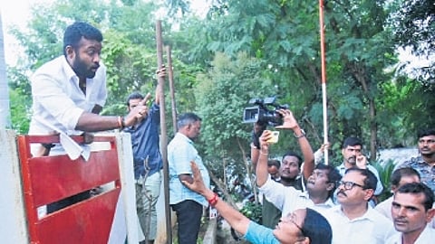 A Congress worker argues with TPCC vice-president Atram Suguna at the party office in Karimnagar on Thursday