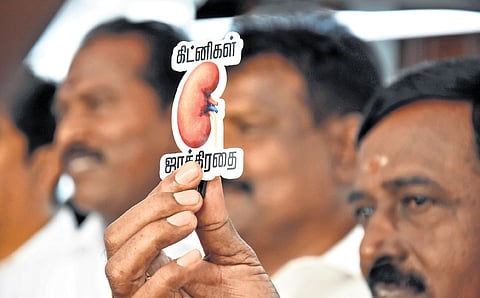 AIADMK MLAs had come to Thursday’s Assembly session wearing badges that read “Kidnigal Jaakkirathai” (Beware of Kidneys!) on their shirt pockets.