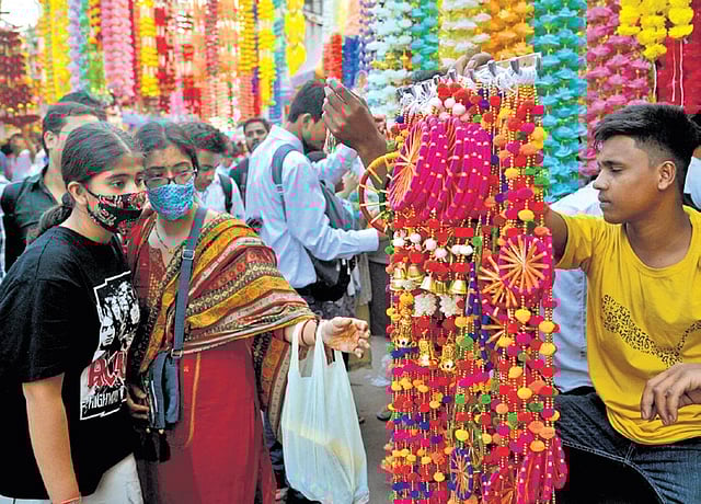 Bustling lanes of Chandni Chowk packed with shoppers, blaring horns and the familiar festive chaos ahead of Diwali