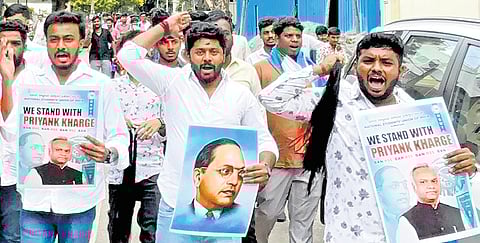 NSUI members protest against RSS to show their support to Minister Priyank Kharge, in front of the RSS office at Chamarajpet, in Bengaluru, on Friday.
