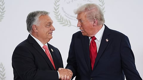 US President Donald Trump (R) greets Hungary's Prime Minister Viktor Orban during a summit to support ending the more than two-year Israel-Hamas war in Gaza after a breakthrough ceasefire deal, Monday, Oct. 13, 2025, in Sharm El Sheikh, Egypt.
