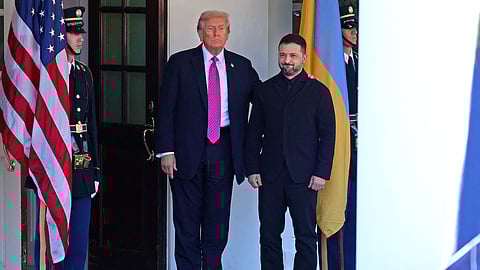 US President Donald Trump welcomes Ukrainian President Volodymyr Zelensky as he arrives for a meeting at the White House in Washington, DC, on October 17, 2025.