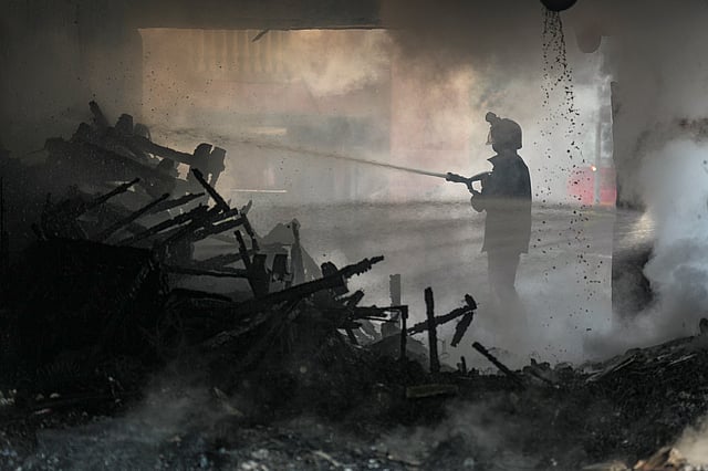 Firefighters try to douse a fire that broke out at Brahmaputra Apartments, in New Delhi, Saturday, Oct. 18, 2025. The apartment complex houses residences of several Lok Sabha and Rajya Sabha MPs.