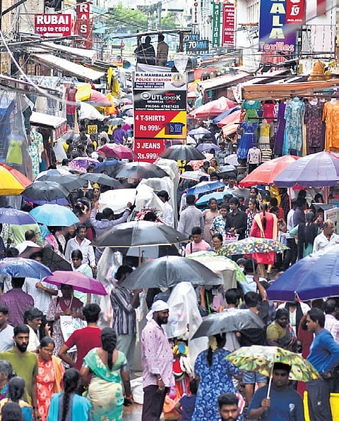 Despite rain, crowds throng T Nagar for Deepavali shopping.