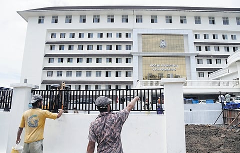 Workers giving finishing touches to the new Corporation building,
set to be inaugurated on October 21 | A Sanesh