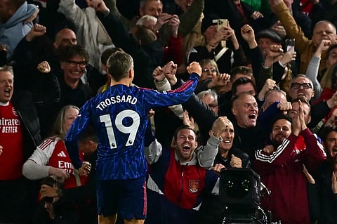 Arsenal's midfielder Leandro Trossard celebrates after scoring the opening goal during the English Premier League football match between Fulham and Arsenal at Craven Cottage in London on October 18, 2025.