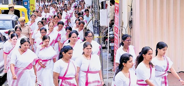 Members of Rashtra Sevika Samiti undertake a ‘path sanchalan’ in Ganganagar, Bengaluru, on Sunday. Union minister Shobha Karandlaje is also seen | Express