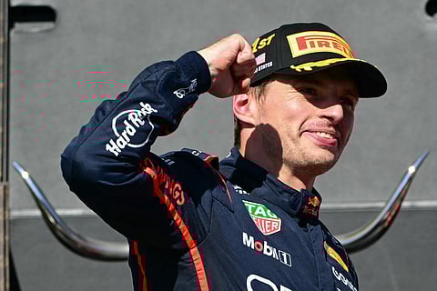 Red Bull Racing's Dutch driver Max Verstappen celebrates on the podium after winning the United States Formula One Grand Prix at the Circuit of the Americas in Austin, Texas, on October 19, 2025.