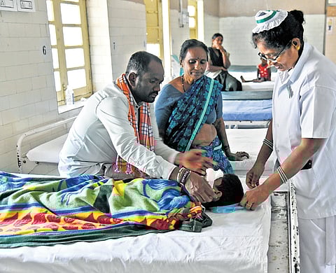 A nurse attends to a patient wounded during Diwali festivities at the Sarojini Devi Eye Hospital, Mehdipatnam, Hyderabad, on Tuesday.