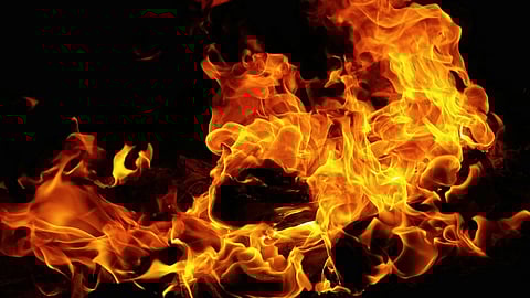 The fire, which reportedly originated from domestic articles due to firecrackers, prompted the DFS to rescue seven individuals.