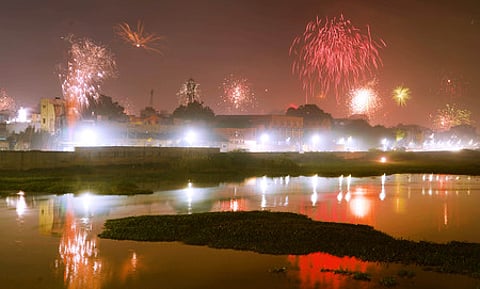 The sky above the Vaigai river bed at Madurai looks colourful as crackers are being as a part of celebrating Deepavali festival on Monday night.