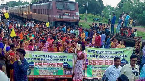 Agitators from the Kurmi community block railway tracks to press for their demand for Scheduled Tribe (ST) status, in Mayurbhanj district on September 20, 2022.