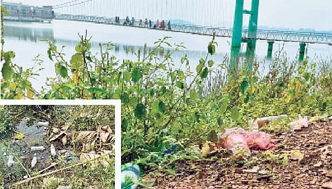 Plastic waste and empty liquor bottles strewn around the Laknavaram lake in Govindaraopet mandal of Mulugu district