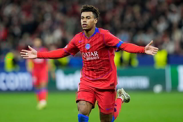 PSG's Desire Doue celebrates after scoring his side's second goal during a Champions League opening phase football match between Bayer Leverkusen and Paris Saint-Germain in Leverkusen, Germany, Tuesday, Oct. 21, 2025.