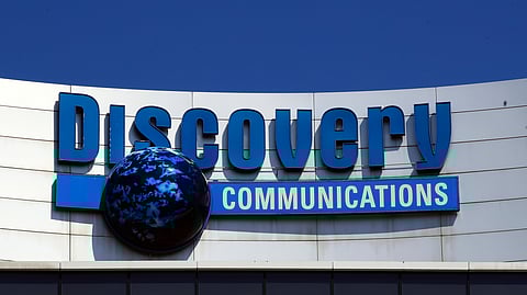 FILE - The Discovery Communications logo atop its headquarters in Silver Spring, Md, July 31, 2017.
