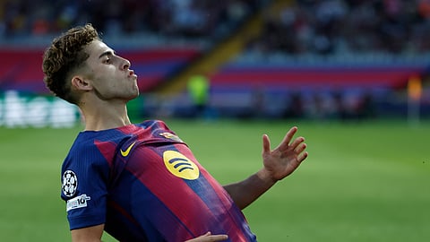 Barcelona's Fermin Lopez celebrates after scoring the opening goal of his team during the Champions League opening phase football match between Barcelona and Olympiacos in Barcelona, Spain, Tuesday, Oct. 21, 2025.