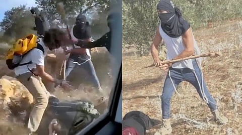 This Oct. 19, 2025, image taken from video shows what appear to be masked settlers beating activists and Palestinian farmers in Turmus Ayya, West Bank.