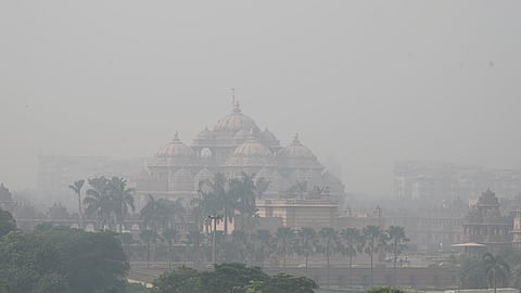 A hazy morning at Akshardham Temple on Wednesday as thick smog engulfs the city, plummeting AQI.