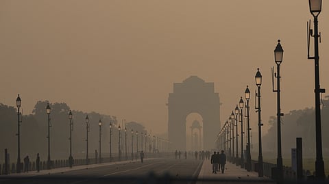 A view of the India Gate on a hazy morning amid low visibility, in New Delhi, Thursday, Oct. 23, 2025.