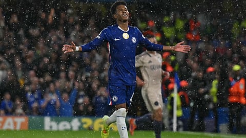 Chelsea's midfielder Estevao celebrates scoring their fourth goal from the penalty spot for 4-1 during the UEFA Champions League league-phase football match between Chelsea and Ajax at Stamford Bridge in London on October 22, 2025.