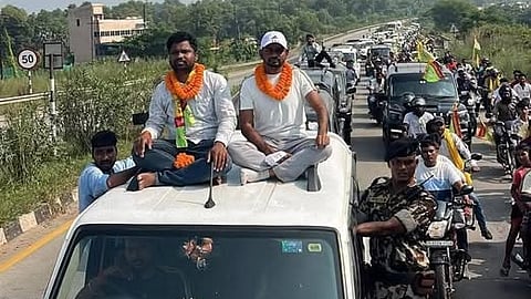 Jairam Mahato and Ramdas Murmu were seen sitting on top of a Scorpio vehicle during their campaign for the Ghatshila bypoll.