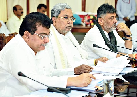 Chief Minister Siddaramaiah, flanked by Deputy Chief Minister DK Shivakumar and Industries Minister MB Patil, chairs the High-Level Project Clearance Committee meeting in Vidhana Soudha on Friday.