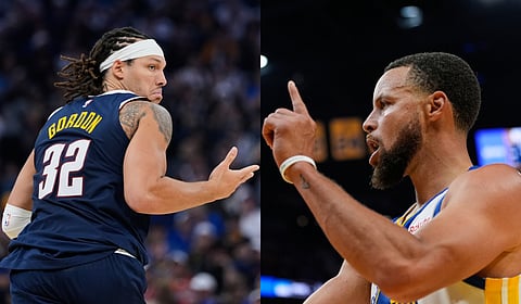 Denver Nuggets' Aaron Gordon (L) and Golden State Warriors' Stephen Curry