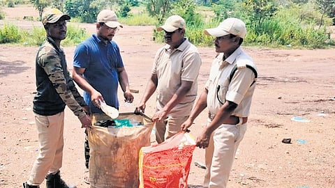 Forest staff collect plastic waste from the vicinity of Bogatha waterfall located in the thick forest area of Wazeedu mandal in the Mulugu district on Friday (left) following a report published by The New Indian Express (clipping below) on Thursday