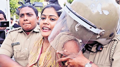 A KSU activist protesting against the PM SHRI scheme being arrested and removed by the police on Saturday near the Secretariat, in Thiruvananthapuram.