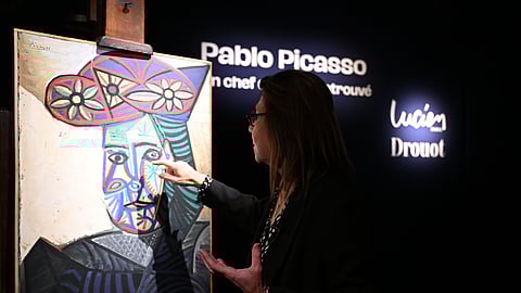 Art expert Agnes Sevestre-Barbe points to a rediscovered Picasso painting, "Bust of a Woman in a Flowery Hat".