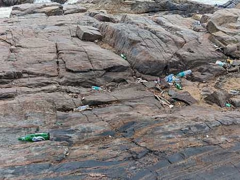 Liquor bottles left in th boulders near Hogenakkal