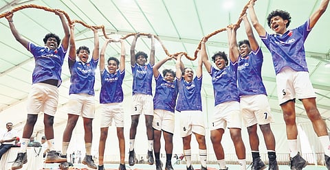 The team from Sree Krishnaapuram HSS, Palakkad, celebrating as they win the first place in the senior boys’ tug-of-war competition at the State School Sports Meet at the Central Stadium.