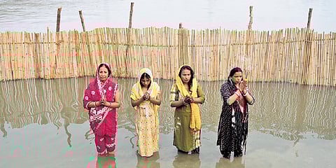 Devotees perform rituals in Yamuna on the first Chhath day on Saturday.