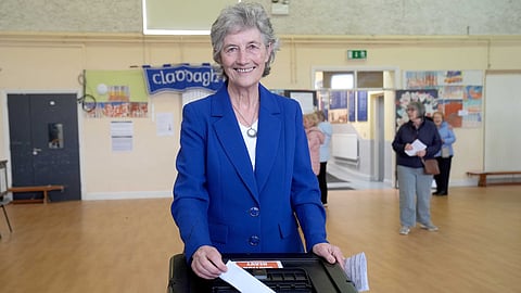 Independent candidate Catherine Connolly casts her vote in the election for the next Irish president at Claddagh National School in Galway city, Ireland, Friday, Oct. 24, 2025.