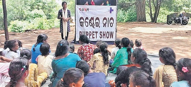 An adolescent group member highlighting social issues among her peers through puppetry show.