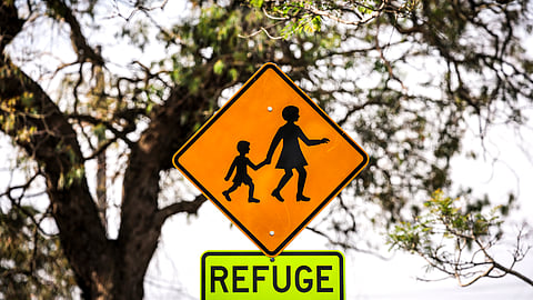 A safety sign is seen outside a primary school in Sydney on October 8, 2025.