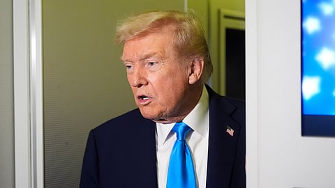 President Donald Trump speaks with reporters aboard Air Force One at Al Udeid Air Base in Doha, Qatar, Saturday, Oct. 25, 2025.