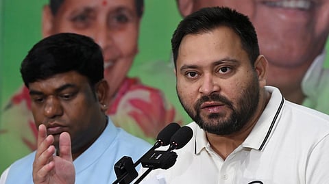 RJD Leader of Opposition Tejashwi Yadav addresses a press conference at his official residence, in Patna, Sunday, Oct. 26, 2025.