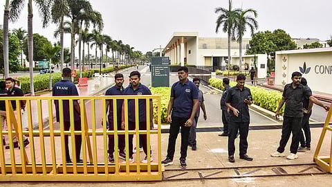 Security personnel stand guard outside a resort where actor-politician Vijay is meeting the families of the Karur stampede victims, in Mahabalipuram