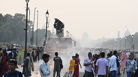An anti-smog gun sprays water droplets to curb air pollution, as air quality deteriorates across northern India, in New Delhi, Sunday, Oct. 26, 2025.