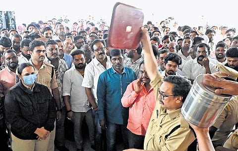 Applicants wait for the draw of lots for liquor shop licences at Banjara Hills on Monday