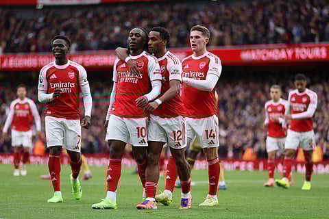 Arsenal's Eberechi Eze, second left, celebrates with his teammates after scoring his side's opening goal during the English Premier League soccer match between Arsenal and Crystal Palace in London, Sunday, Oct. 26, 2025.