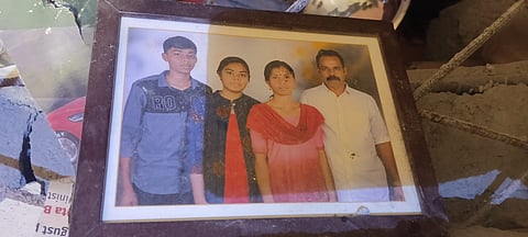 A photo of Biju with his family found by rescue workers inside his home.