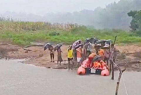 A pregnant woman and kids being shifted to safer place in Gajapati district.