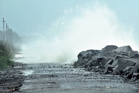 High tides under the influence of Montha batter the Uppada road in Kakinada district