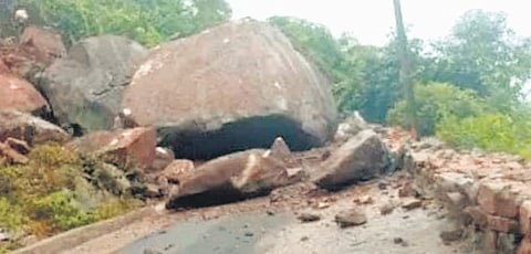 Huge rocks blocking the road after landslide at Badagaon ghat in R Udayagiri block.