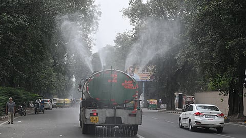 An anti-smog gun sprays water droplets to curb air pollution, as air quality deteriorates across northern India, in New Delhi on Monday, Oct. 27, 2025.
